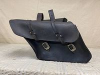 Side view of one black leather Harley-Davidson saddlebag