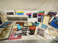 Overview of entire lot with train brochures, panoramic photo, portraits, letters, Tiffany folder