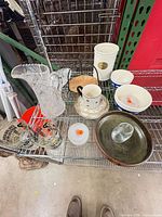 Entire group of assorted glass, ceramic and stoneware items on shelf