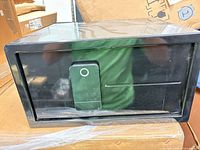 Front view of black MyCube safe with keypad