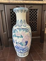 Full view showing entire vase with one bird scene and decorative borders