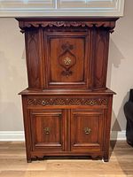 full view of cabinet front showing both sections and hardware