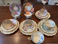 Overview of all five teacup groupings laid out on table