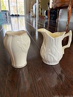 Front view of vase and pitcher