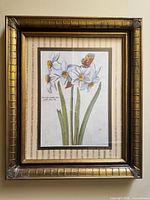 Full view of framed floral print showing artwork, mat and frame