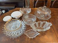 All ten glass pieces displayed on table