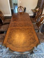 Top view of dining table showing veneer pattern and leaves inserted