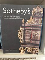 Cover of The Art of Flanders catalogue, shows detail of ornate cabinet