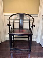 Front angled view of the wooden armchair