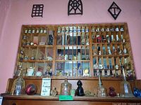 Full wall cabinet and shelf showing majority of miniatures