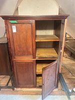 Full cabinet showing both sections and open lower door