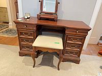 Front view of vanity with bench showing drawers and hardware