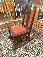 full front view of wooden rocking chair on rug