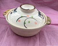 Lidded ceramic braiser, side view