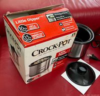 Box front showing brand, model, capacity 16oz, slow cooker partially visible