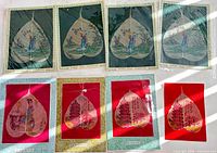 Group shot of eight bodhi leaf paintings on two rows