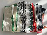 Stack of assorted towels showing variety of colours and patterns