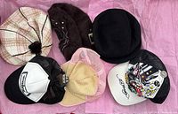 All six hats laid out showing variety of styles and colors