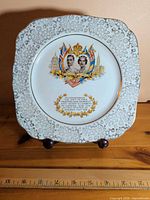 Front view of full plate showing shape, border and central commemorative design