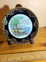 front view showing design, gold border and central poem scene