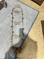 Full view of metal wall etagere showing overall design and size