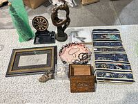 Lot overview with jewelry organizer, sculpture, dartboard, frame, box, baseball, figurine