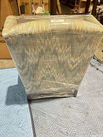 Rear view of chair displaying back upholstery pattern