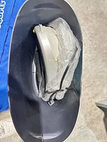 Top view into bin showing shredder head and cord