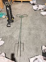 Full view of two-piece shepherd's hook stake on floor