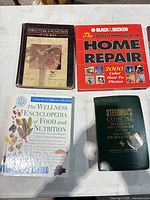 Four books including Structure & Function of the Body, Black & Decker Home Repair, Wellness Encyclopedia, Stedman's Medical Dictionary