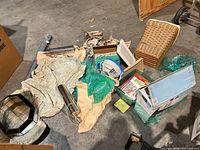 Group shot showing most items scattered on floor including basket, fan, fabric, lighting, cords