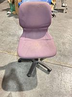Front view of purple armless task chair showing seat stains and base