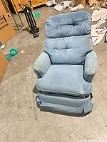 Front view of recliner showing fabric, seat, arms and overall wear