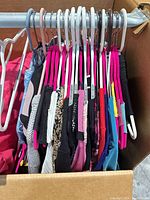 Multiple garments on hangers inside box