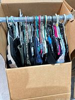 Women’s garments on hangers inside box
