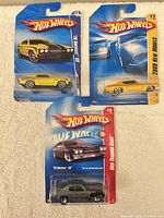All three Hot Wheels ’70 Chevelle SS cars on their blister cards