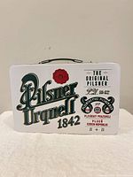 Front view showing Pilsner Urquell 1842 graphic