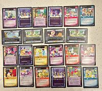 All 22 cards laid out front-side up to show titles, artwork and condition