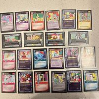 Front view of all 22 My Little Pony CCG cards in sleeves