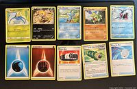 Full lot showing 5 Pokémon cards top row and 5 Energy/Trainer cards bottom row