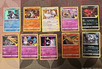 All eleven Pokémon cards laid out