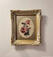Front view of framed needlepoint with roses