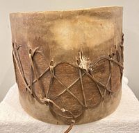 Side view showing rawhide side covering and lacing