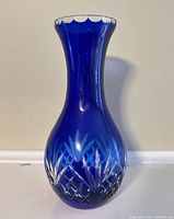 Front view showing cobalt color, cut pattern, scalloped rim