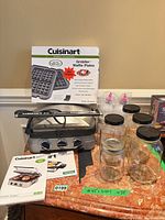 Overall lot showing Griddler, waffle plates box, manuals, five mason jars