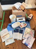 Group shot showing towels in box, ceramic accessories, tissue box cover, dummy head, sealed liners, fabrics