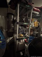 Full view of HDX gray plastic 5-shelf storage unit loaded with household items