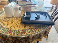 Electric griddle, kettle, and jug on table