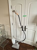 Full view of JiffySteamer J-2 showing base, pole, hose and head