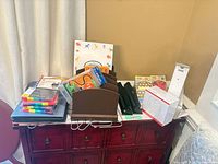 Overall lot view showing desk organizers, hole punches, Post-it supplies, Phomemo printer box